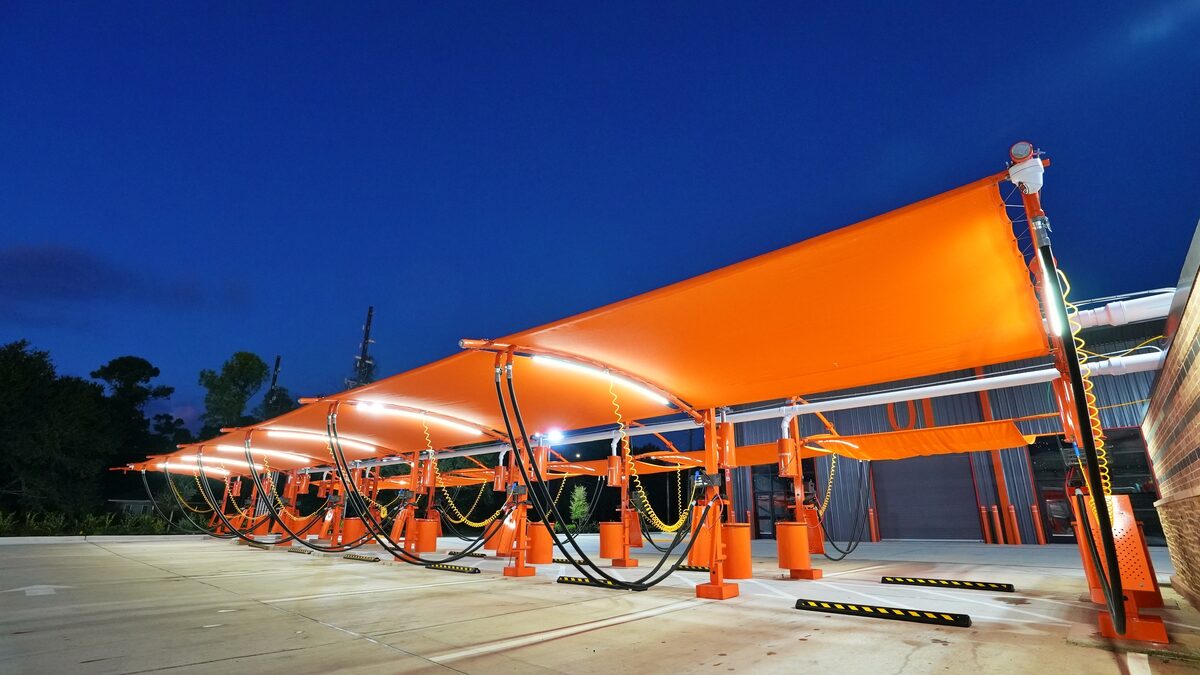 Orange canopy vacuum stations at dusk