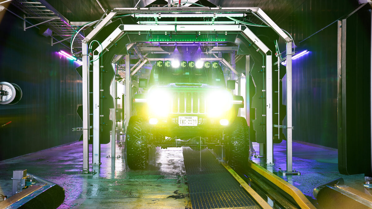 Lifted Jeep going through the Spark Carwash tunnel with LED lights